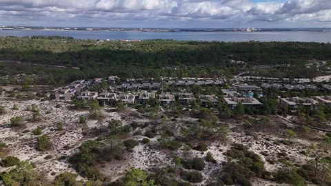Aerial drone pull back from the exclusive Pestana Troia Eco-resort in Troia Stock Footage 319497742
