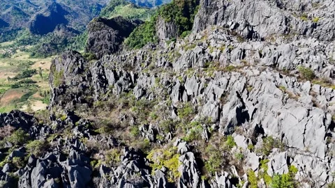 Aerial drone pull-back of karst mountains, Thakhek Loop Laos – 4K Stock Footage 325079459