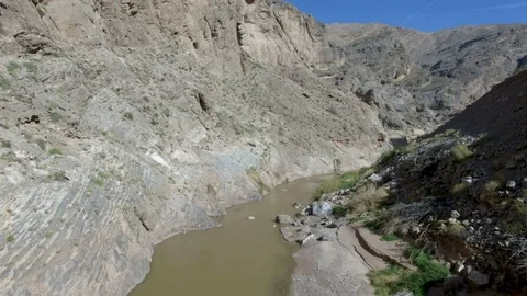 Aerial drone pull back of lonely river in giant rocky canyon Stock-Footage 99313905