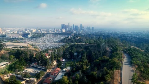 Aerial drone pull back Los Angeles city views above iconic Police Academy Stock Footage 110930142