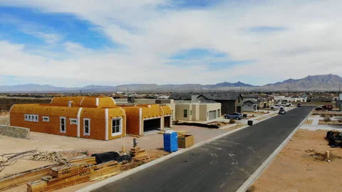 Aerial Drone Pull Back from New Home Construction in Subdivision Stock Footage 243656445