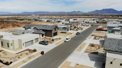 Aerial Drone Pull Back from New Subdivision to Reveal Empty Lot Stock Footage 243656641