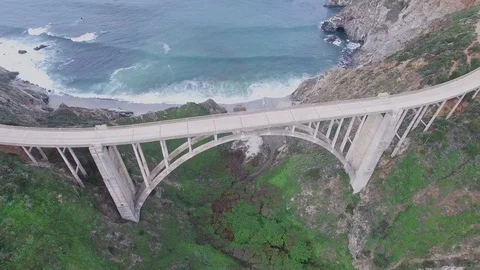 Aerial Drone Pull Back Over Bixby Bridge and Ocean In Big Sur California Stock Footage 84038778