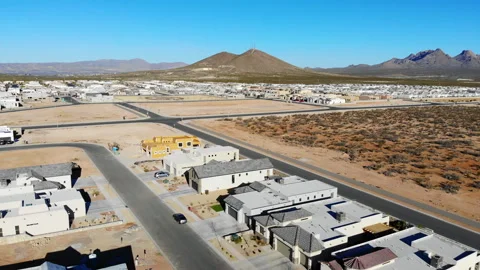 Aerial Drone Pull Back Over New Southwest Subdivision Construction with Mountain Stock Footage 243656411