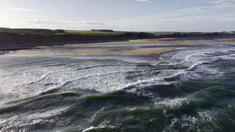 Aerial Drone Pull Back Over Ocean Waves and Sandy Beach Coastline Video stock 333784702
