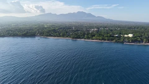 Aerial Drone, Pull Back Over Bay to Cuernos de Negros Volcano, Philippines, 4K Stock Footage 336475437