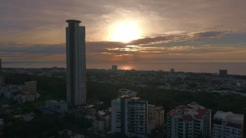 Aerial Drone Pull Back Over Santo Domingo Cityscape with Caney Tower at Sunrise Stock Footage 342050538