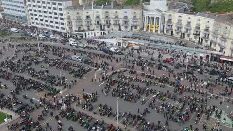Aerial drone pull back reveal shot of Pelham Arcade, Hastings May Day Bike Run Stock Footage 335341365