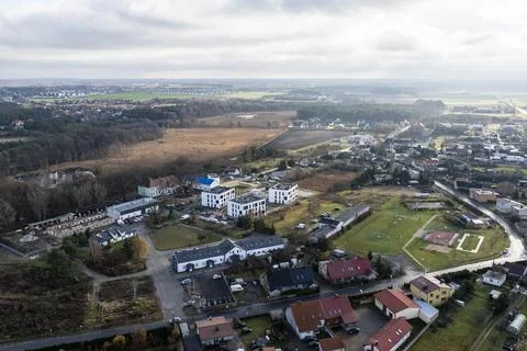 Aerial Drone Pull Back Shot of Modern Housing Estate in Rural Landscape Stock Photos