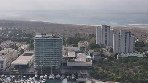 Aerial drone pull back view of marina and casino in Troia, Portugal Stock Footage 319452009