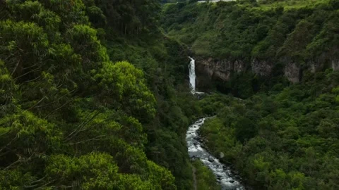 Aerial Drone Pull Out Shot of Waterfall and River Through Lush Green Valley Stock Footage 325835512