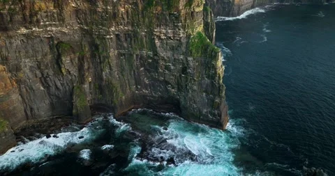 Aerial drone pullback from Cliffs of Moher revealing O'Brien's Tower and Stock Footage 339503377