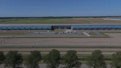 Aerial drone pullback from Google data center in Middenmeer Netherlands Stock Footage 343839831