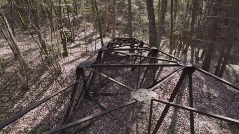 Aerial Drone Pullback Over Rusty Metal Tower in spring Forest Stock Footage 332308465