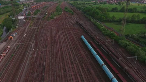 Aerial Drone Pullback Revealing Freight Trains and Railway Yard Stock Footage 334008693