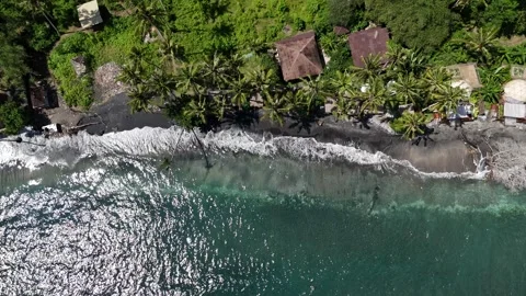 Aerial Drone Pullback Rising From Black Sand Beach Revealing Backdrop Gamat Bay Stock-Footage 330540535