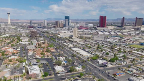 Aerial drone pullback shot of Las Vegas Strip hotels and downtown Vegas skyline Stock-Footage 333484235