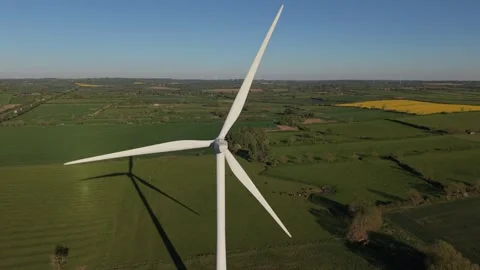 Aerial drone pullback from wind turbine over countryside fields Stock-Footage 333936719