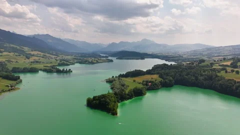 Aerial drone pulling back above Lake Gruyere islands Stock Footage 342275606