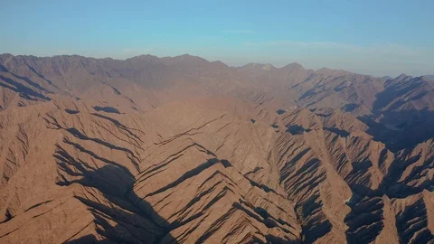 Aerial drone push-in fly over shot of the Hajjar mountain in Fujairah, Video stock 120834620