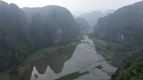 Aerial Drone Push-In Over Karst Mountains and River in Ninh Binh, Vietnam Stock Footage 330061563