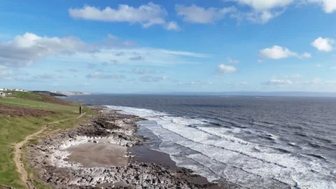 Aerial Drone Push Over Rocky Green Coast Toward Sea, Wales UK 4K Vidéo 334066863