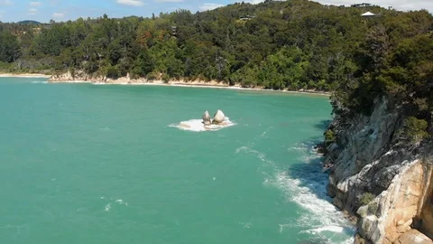 Aerial drone push-in pull-down shot of Split Apple Rock in the middle of Stock Footage 111162835