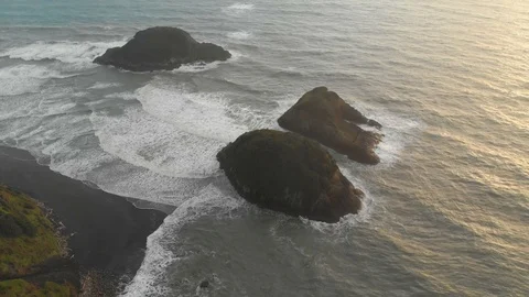 Aerial drone push-in shot of three small islands off the coast of New Stock Footage 110337901
