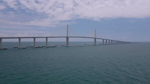Aerial drone push toward Sunshine Skyway Bridge over Tampa Bay Stock Footage 334726600