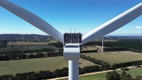 Aerial Drone Push In Toward Wind Turbine Stock Footage 332749971