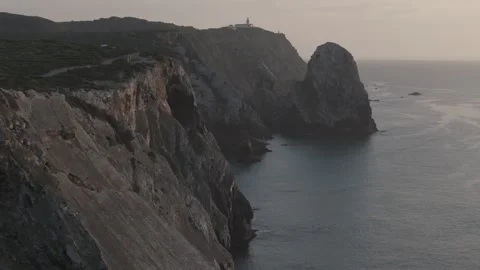 Aerial drone reveal of breathtaking cliffs near Cabo da Roca, Portugal at dusk Stock Footage 290373961