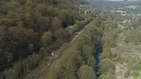 Aerial drone reveal of train pulling into station Stock-Footage 110831232