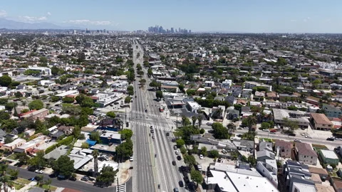 Aerial Drone Reverse Dolly Over Venice Boulevard Away from Beverly Hills Stock Footage 334041021