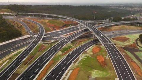 Aerial drone reverse view above the M7-M12 Interchange at Cecil Hills, NSW Stock-Footage 344094083