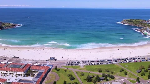 Aerial drone reverse view of Bondi Beach in Sydney with blue ocean in background Stock-Footage 213277133