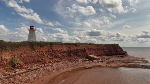 Aerial Drone Rises Around Cape Egmont Lighthouse, PEI Red Cliffs Stock Footage 341363162
