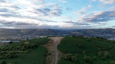 Aerial Drone Rising Over Caerphilly Mountain Beneath Dramatic Clouds, Wales Stock Footage 343577766