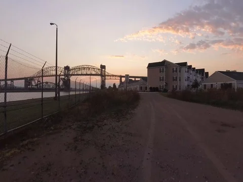 Aerial drone rising overlooking Sault Ste Marie International Bridge Stock Footage 80895023