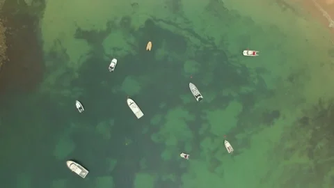 Aerial Drone Rotating Looking Directly Down on Boats in Bay Video stock 308510882