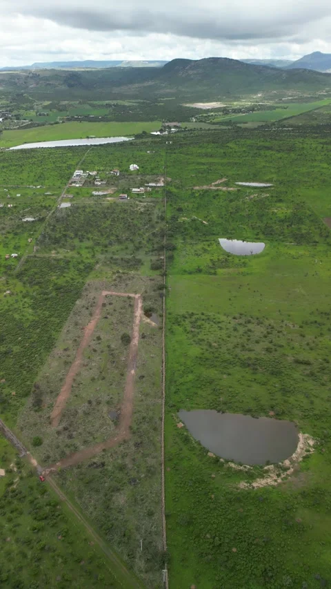 Aerial drone of a rural land plot and green ranchland, central Mexico 스톡 동영상 341547967