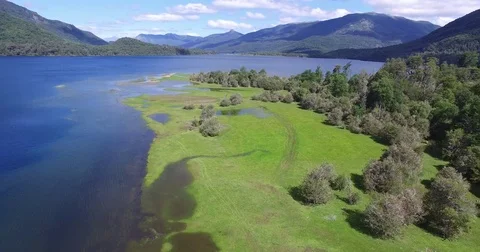 Aerial drone scene of green grass coast of lake in Patagonia Argentina. 스톡 동영상 72249448