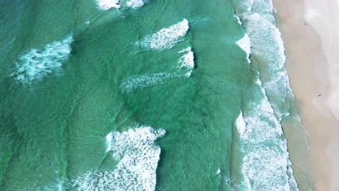 Aerial drone scene of ocean waves on paradisiacal beach with turquoise Stock Footage 230558491