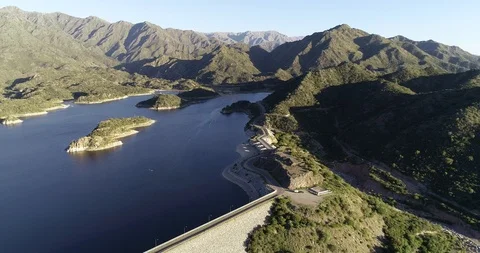 Aerial drone scene of panoramic view of dam with its lake. Flying following road 스톡 동영상 119012056