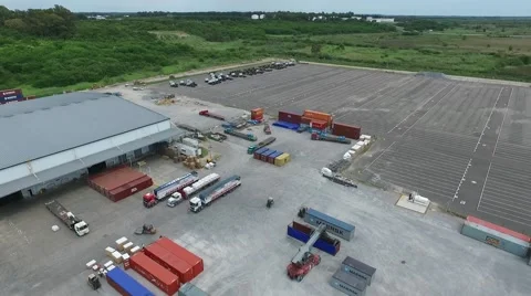 Aerial drone scene while workers are prepairing a shipping, trucks, containers, Vídeo Stock 59964268