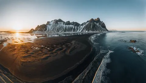 Aerial Drone scenic image of famous Stokksnes cape and Vestrahorn Mountain with Stock Photos