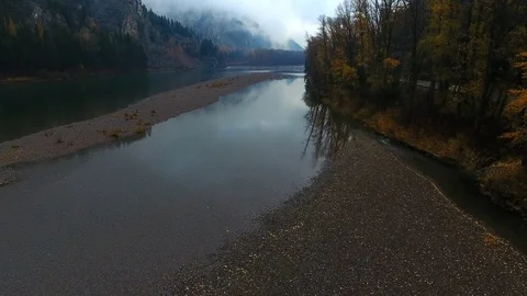 Aerial drone scenic Montana river with tree reflection mountains, trees,  Stock Footage