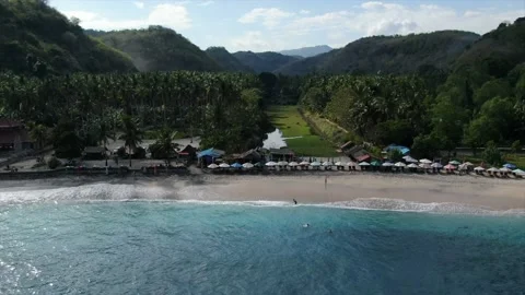 Aerial drone setting over picturesque beautiful beach lagoon in Bali 4K Stock Footage 136453653