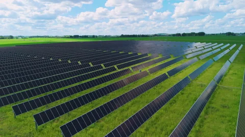 Aerial drone shoot of a large solar farm with rows of photovoltaic panels Stock Footage 340384443