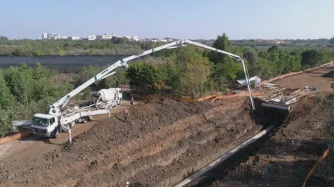Aerial drone shot above constructions site outdoor. Heavy machinery white crane Stock Footage 131013528