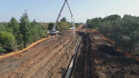 Aerial drone shot above constructions site outdoor. Big white crane pouring Video stock 131013674